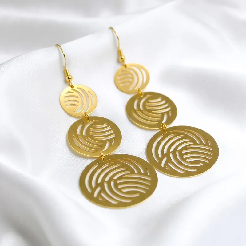 Long Gold earrings with laser-engraved spirals